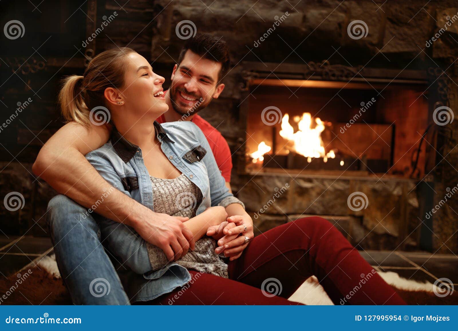 Couple Makes Passionate Love By The Fireplace