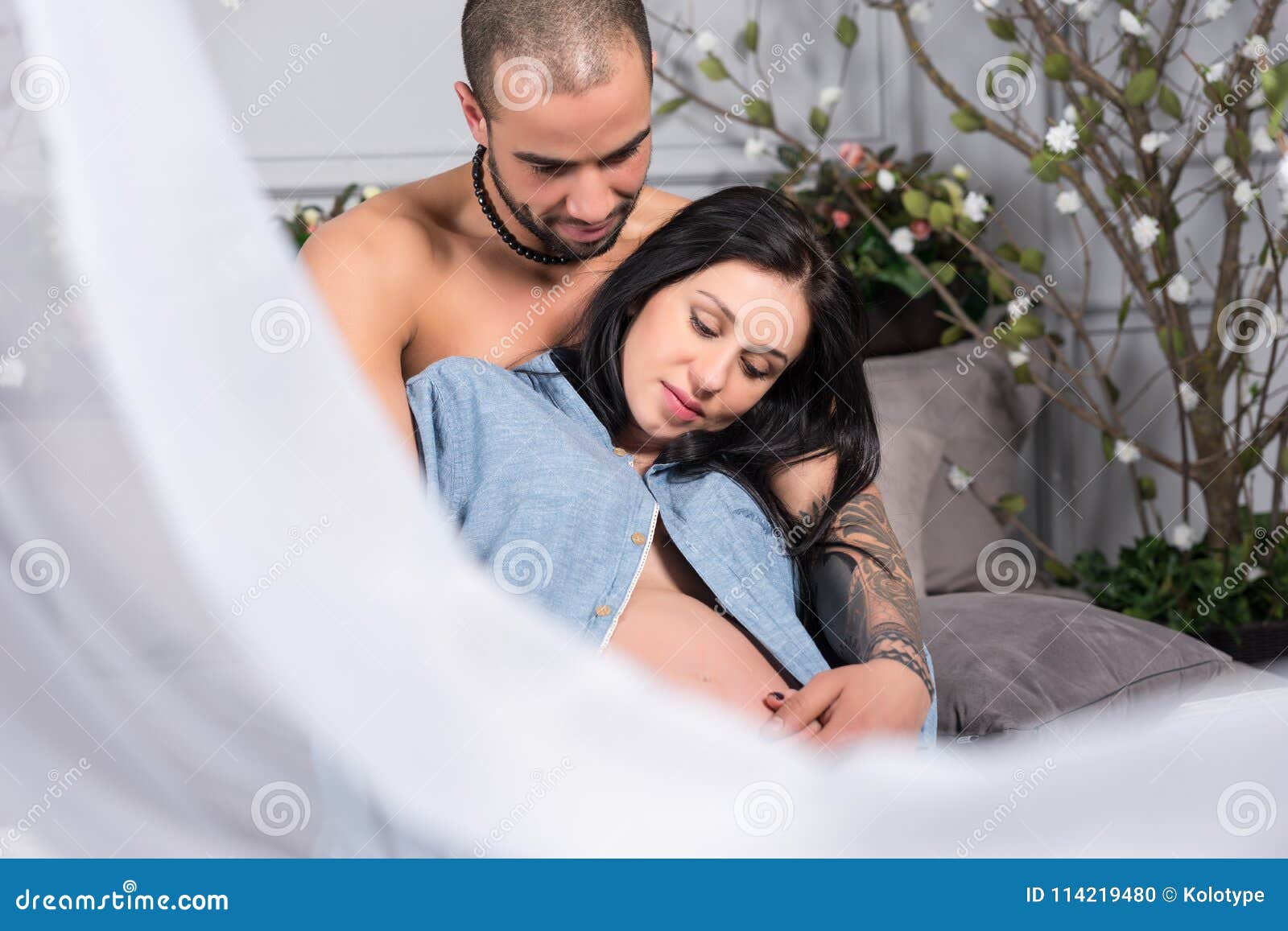 Handsome man on bed stock photo. Image of chest, lying 