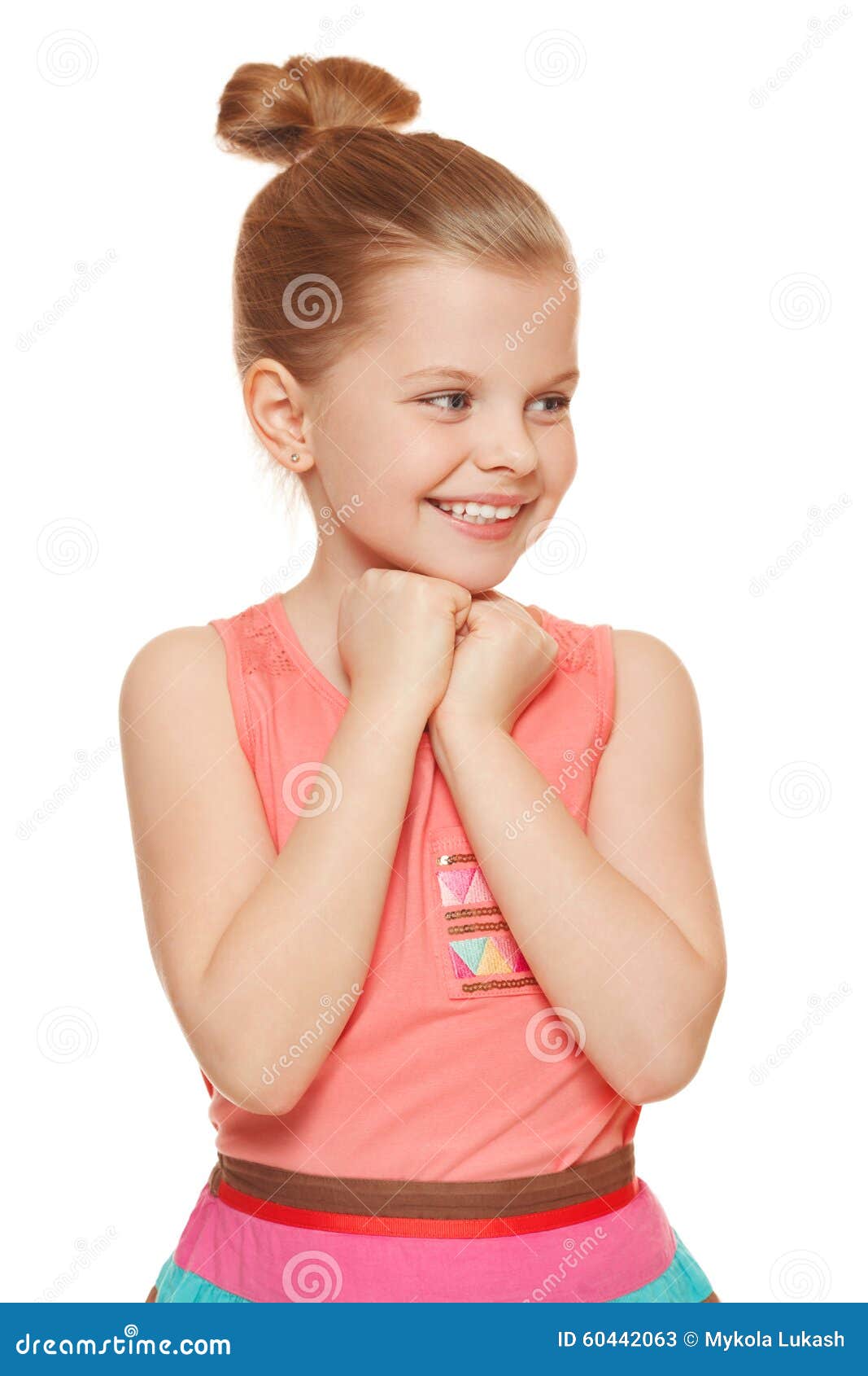 happy joyful little girl looking sideways in excitement,  on white background