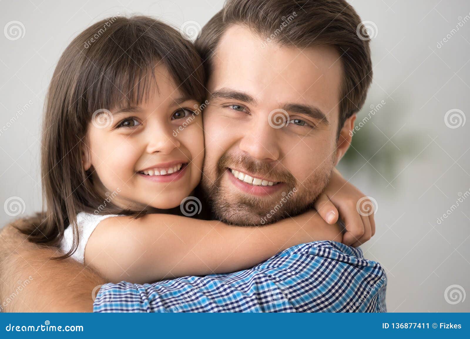 Happy Kid Hugging Dad Holding Tight Cuddling Looking at Camera ...