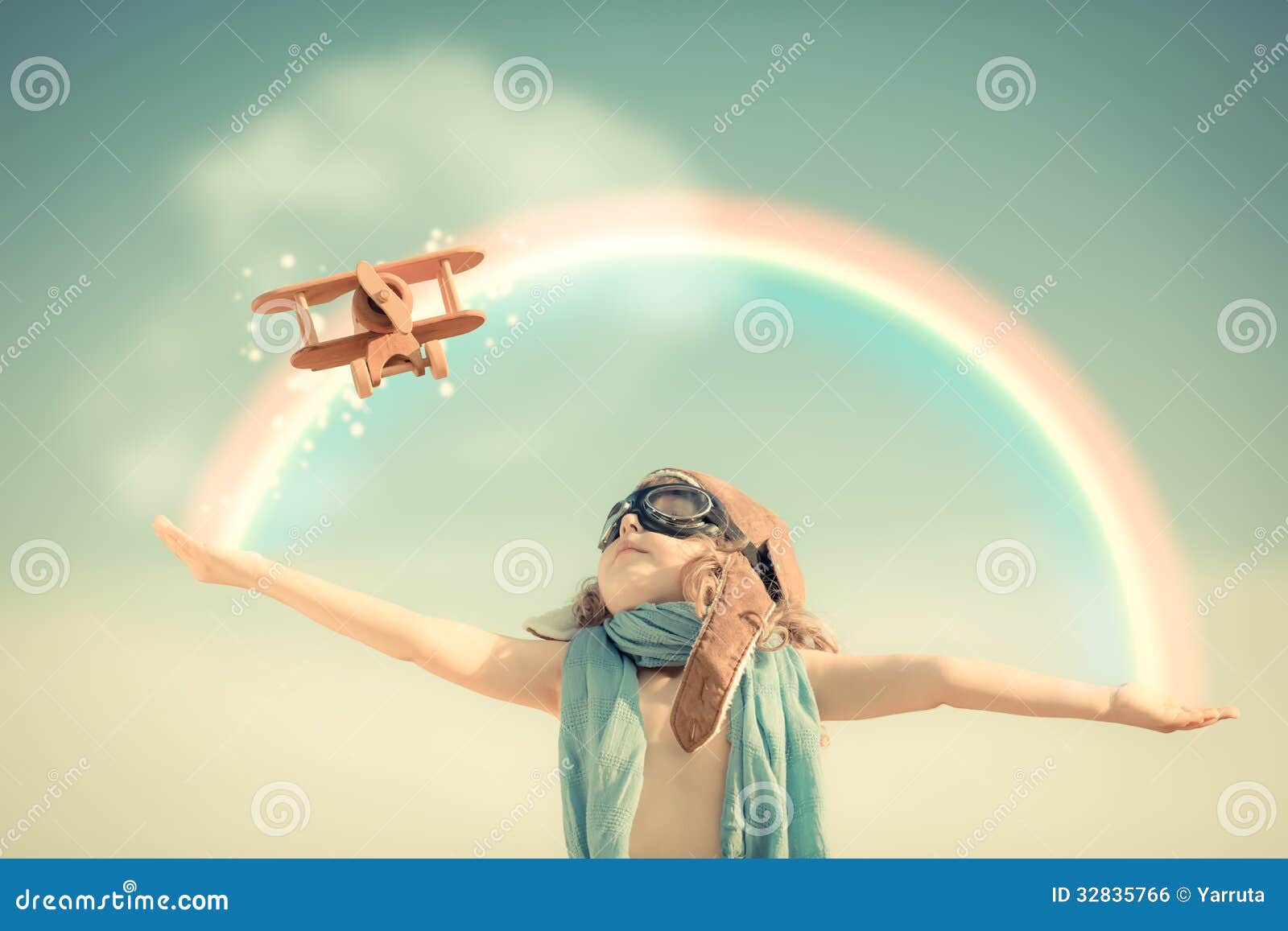 happy kid playing with toy airplane