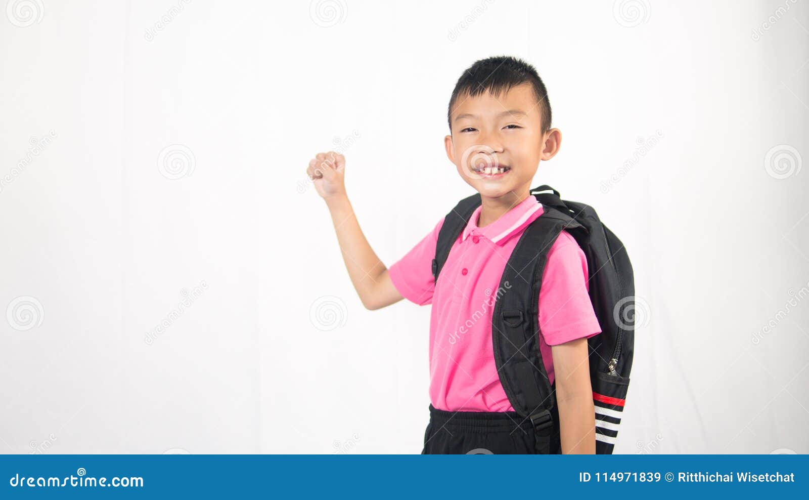 kid holding backpack