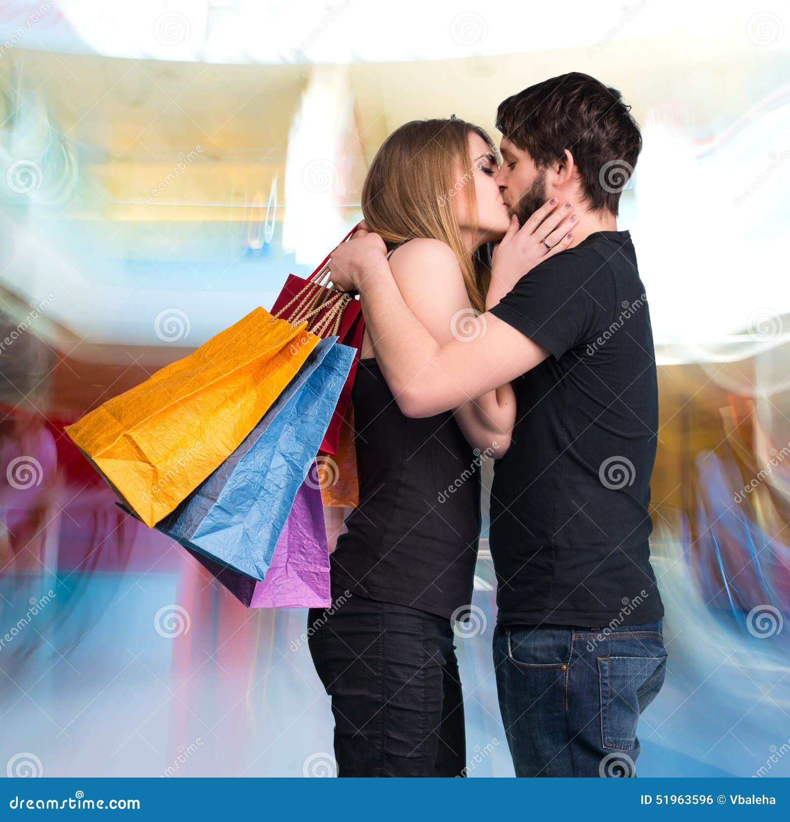 [Image: happy-kissing-couple-shopping-bags-mall-51963596.jpg]