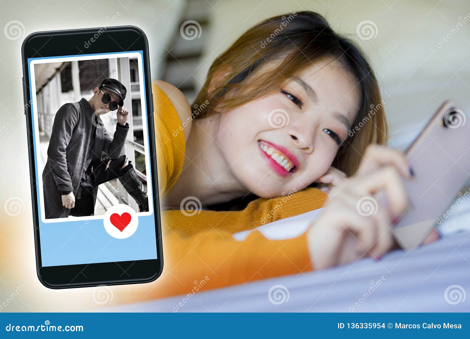 Happy Korean Woman In Bed Using Mobile Phone Doing Video Call Or Flirting Online Via Social Media Dating App With Cool Man In Stock Photo Image Of Handsome Chinese 136335954