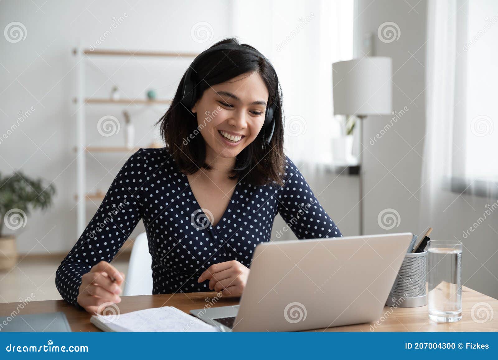 Happy Korean Woman in Headset Involved in Video Call Conversation ...