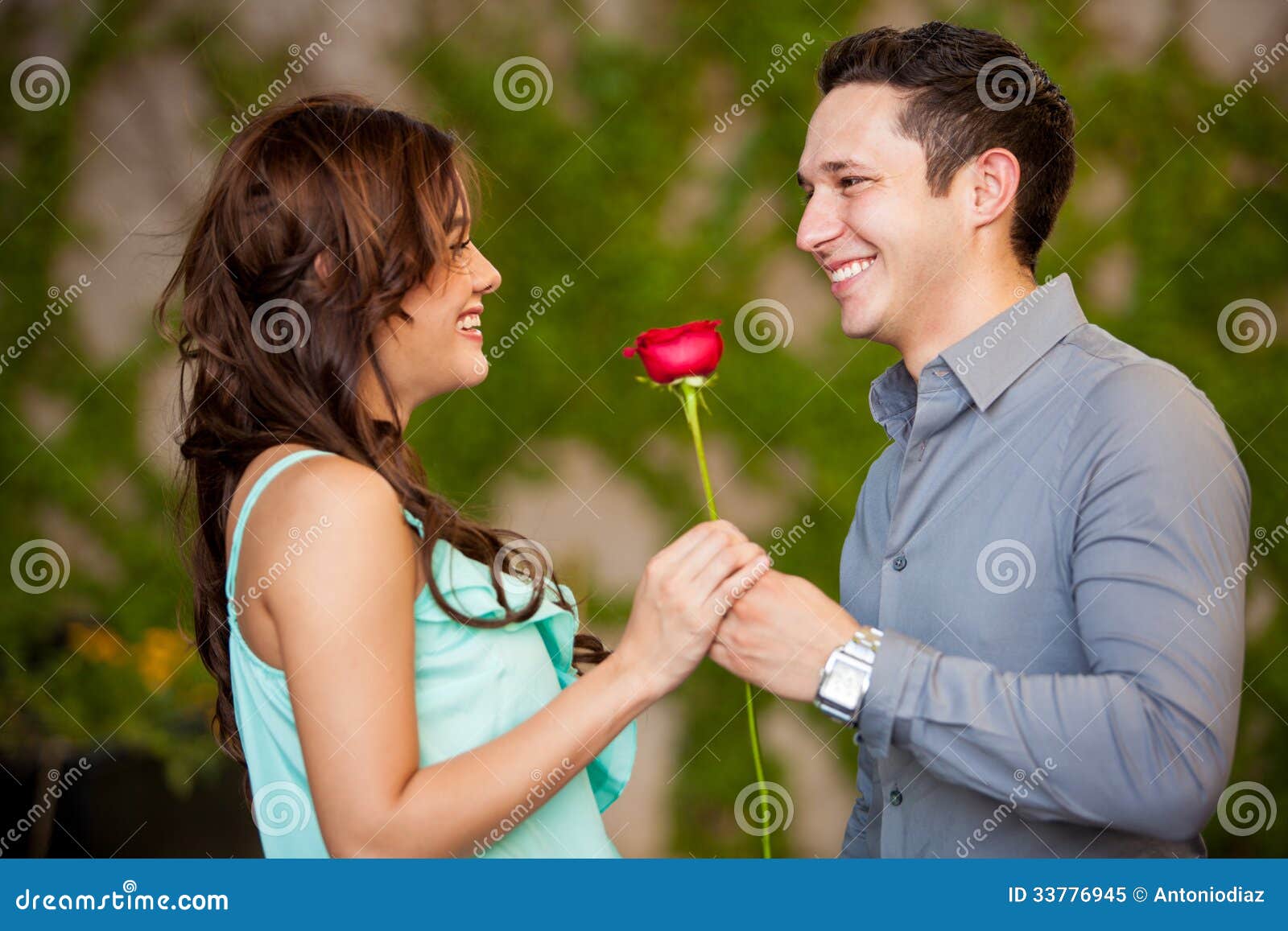 http://thumbs.dreamstime.com/z/happy-latin-couple-love-beautiful-brunette-getting-red-rose-her-date-smiling-33776945.jpg