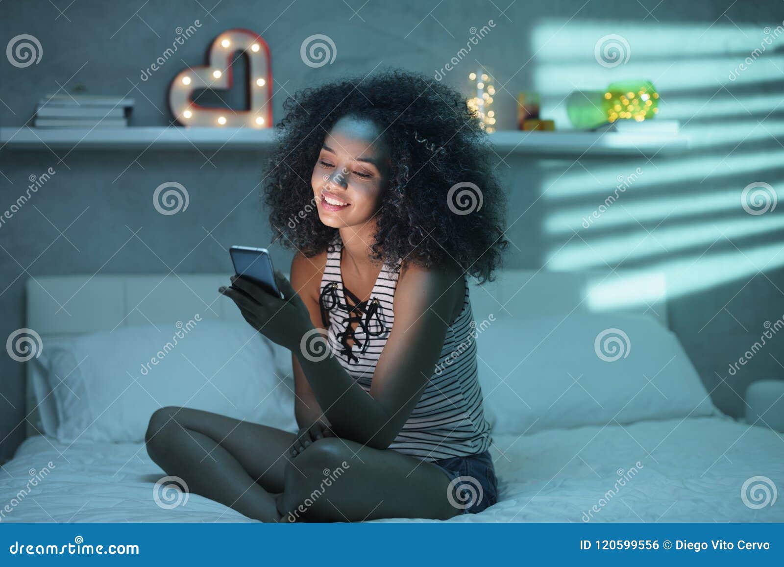 Happy Latino Woman Watching Video on Smartphone Stock Photo - Image of  film, diverse: 120599556
