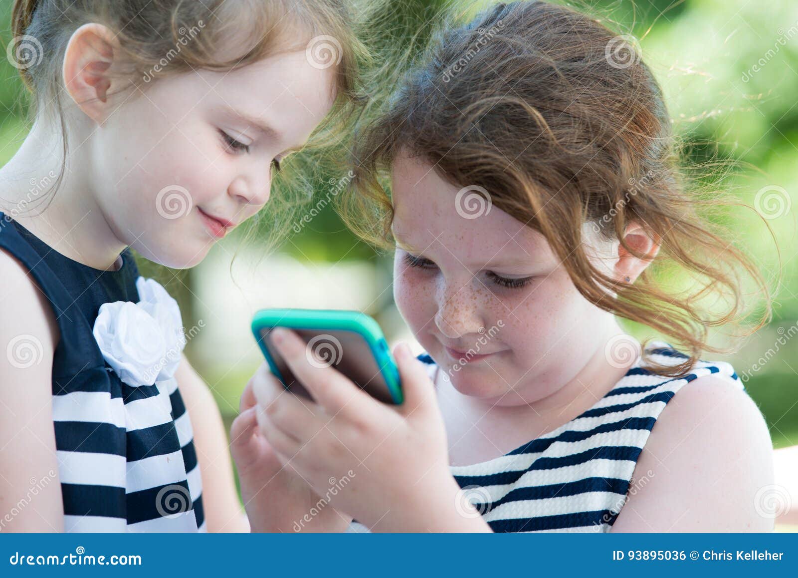 Happy Laughing Children Playing with Smartphone Outside Stock Photo ...