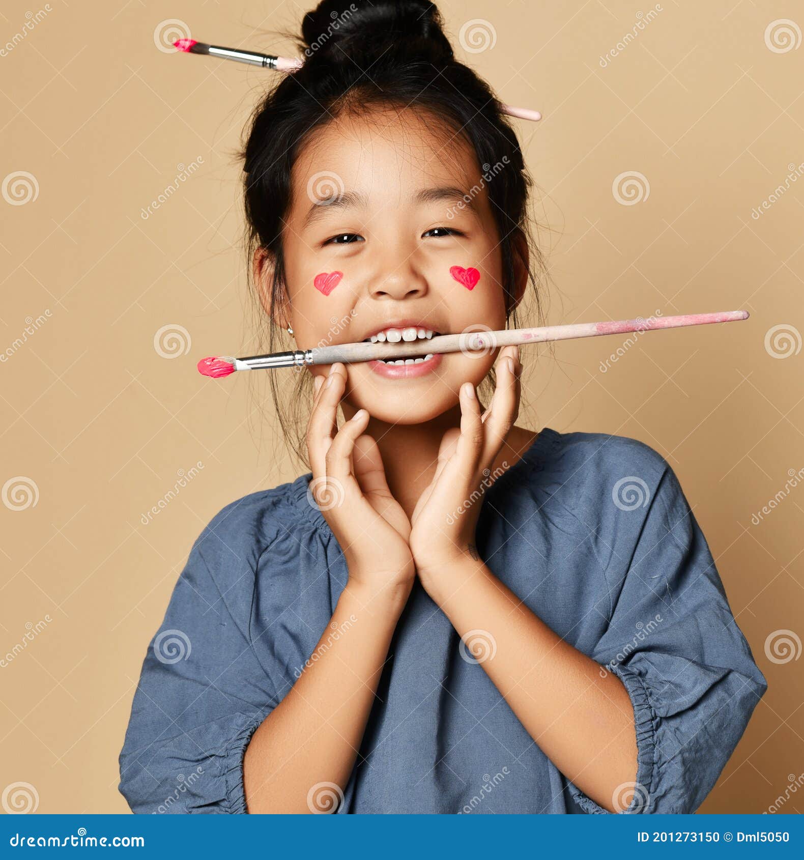 Happy Laughing Joyful Asian Kid Girl Artist with Painted Red Hearts on  Cheeks and with Brush in Hair and between Teeth Stock Photo - Image of  ethnic, artist: 201273150