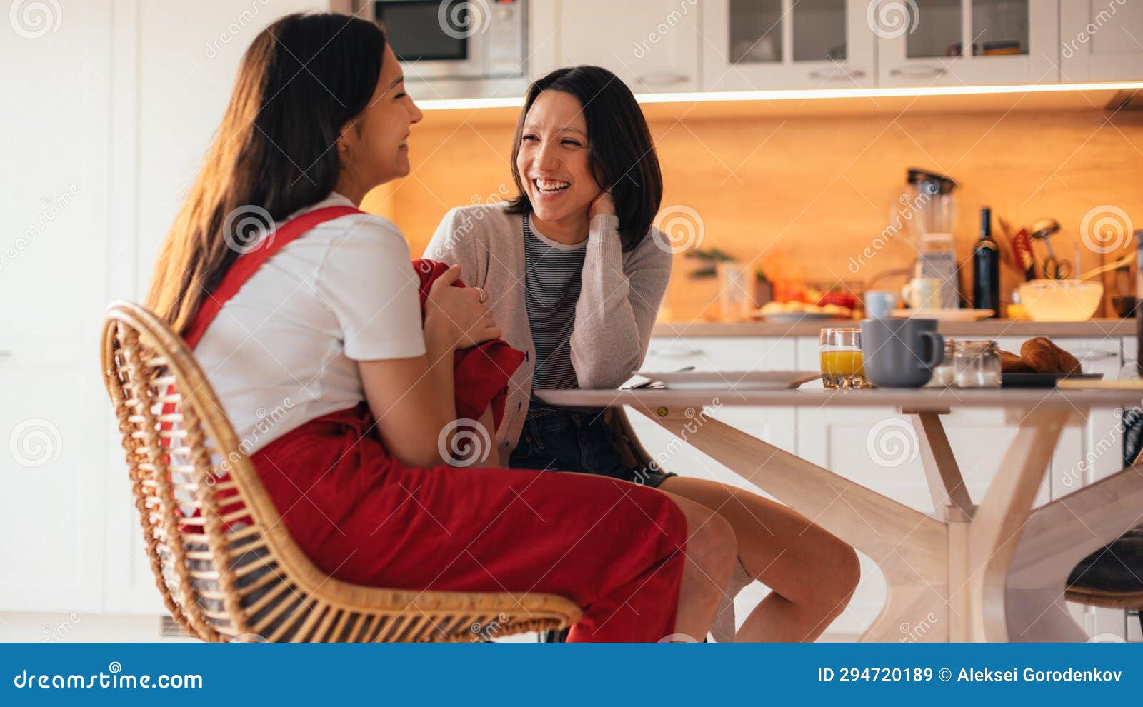 Happy Lesbian Couple Have Pancakes And Croissants For Breakfast Sunday