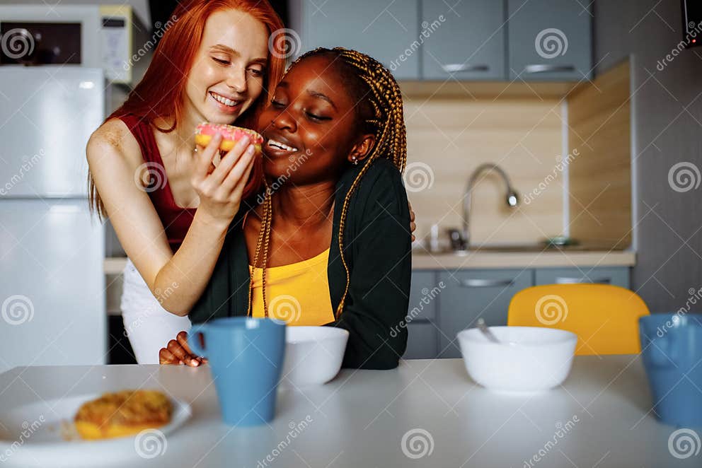 Happy Lesbian Couple Preparing Breakfast In The Kitchen Stock Image Image Of Affection