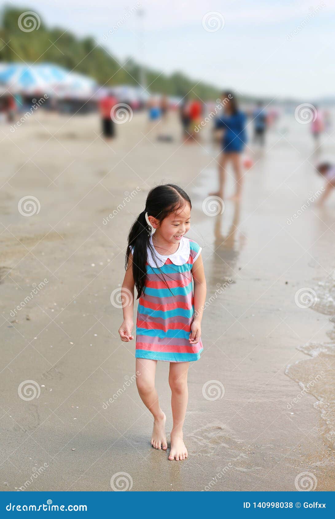 Happy Little Asian Child Girl Has Fun on the Sand Beach on Holiday ...