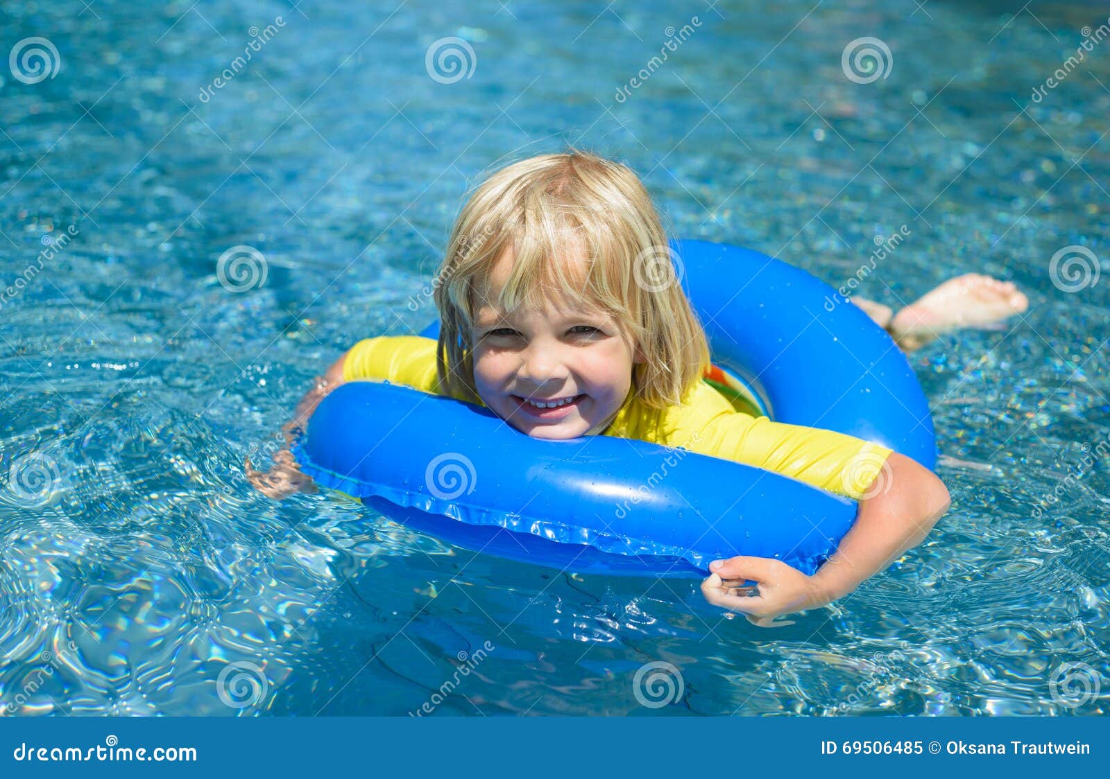 Happy Little Boy with Blue Life Ring Has Fun in the Swimming Po Stock ...