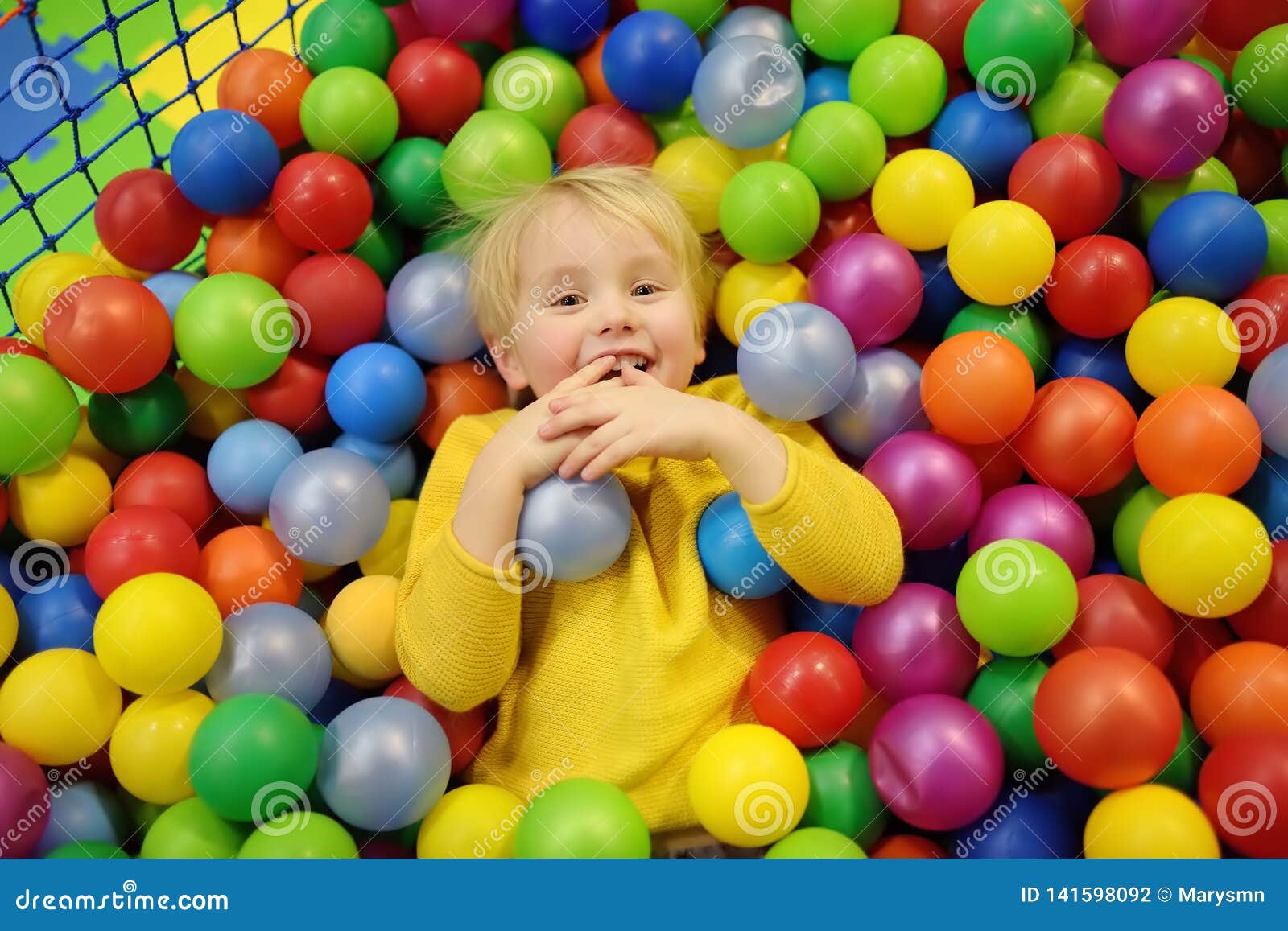 kid in ball pit