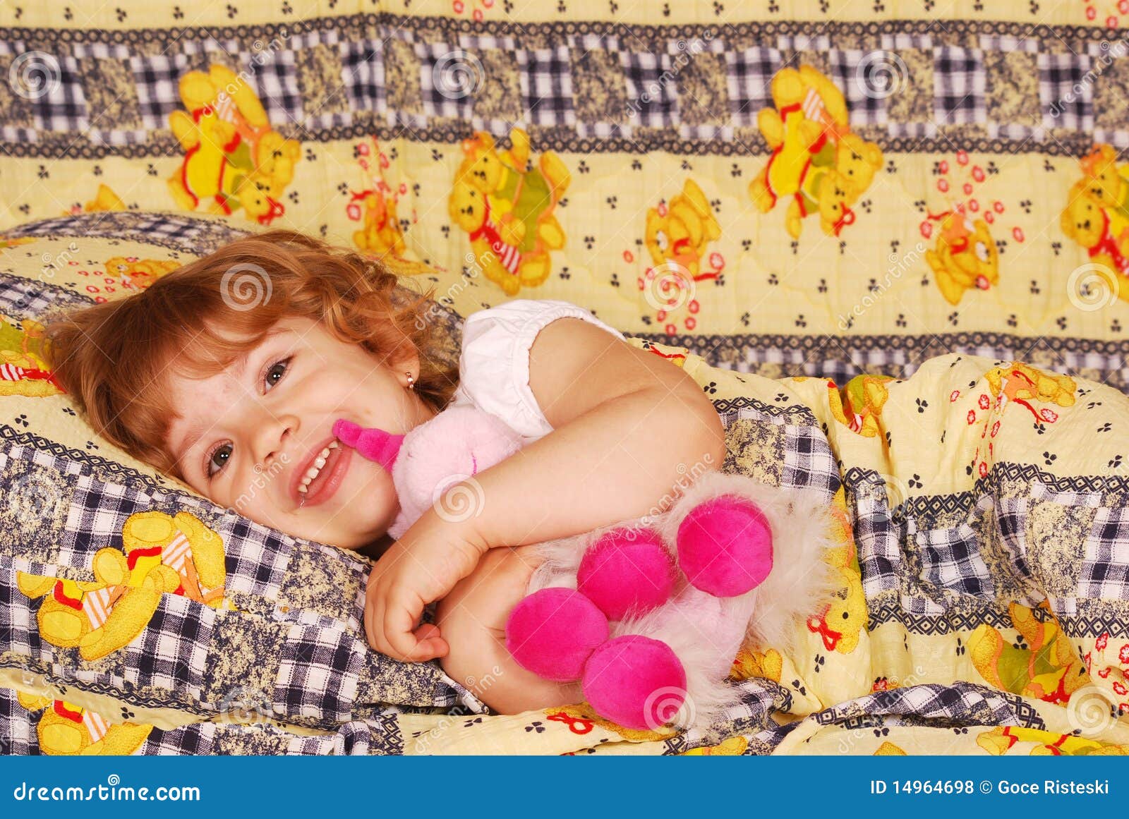 Happy little girl bedtime stock photo. Image of beauty 14964698