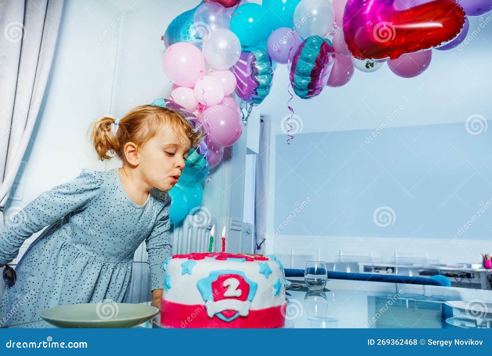 Happy Little Girl Blow Candles on the Birthday Cake Party Stock Photo ...