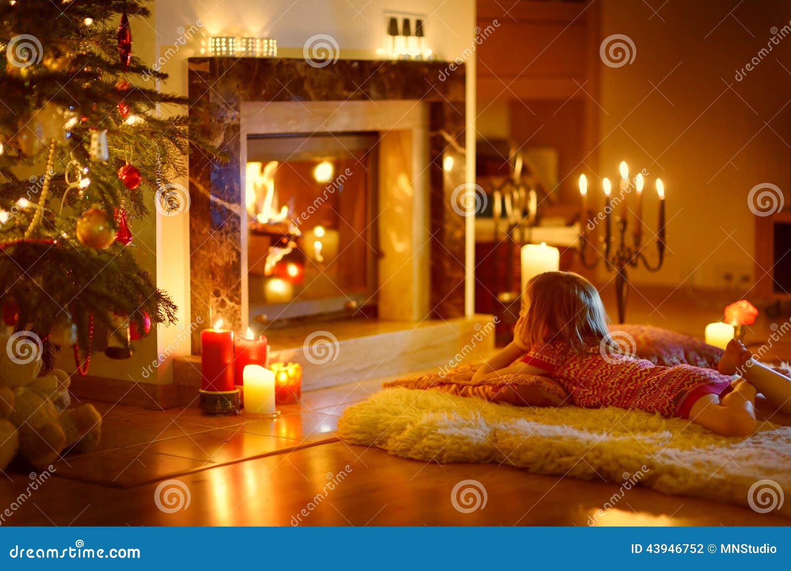 Happy Little Girl By A Fireplace On Christmas Stock Photo 