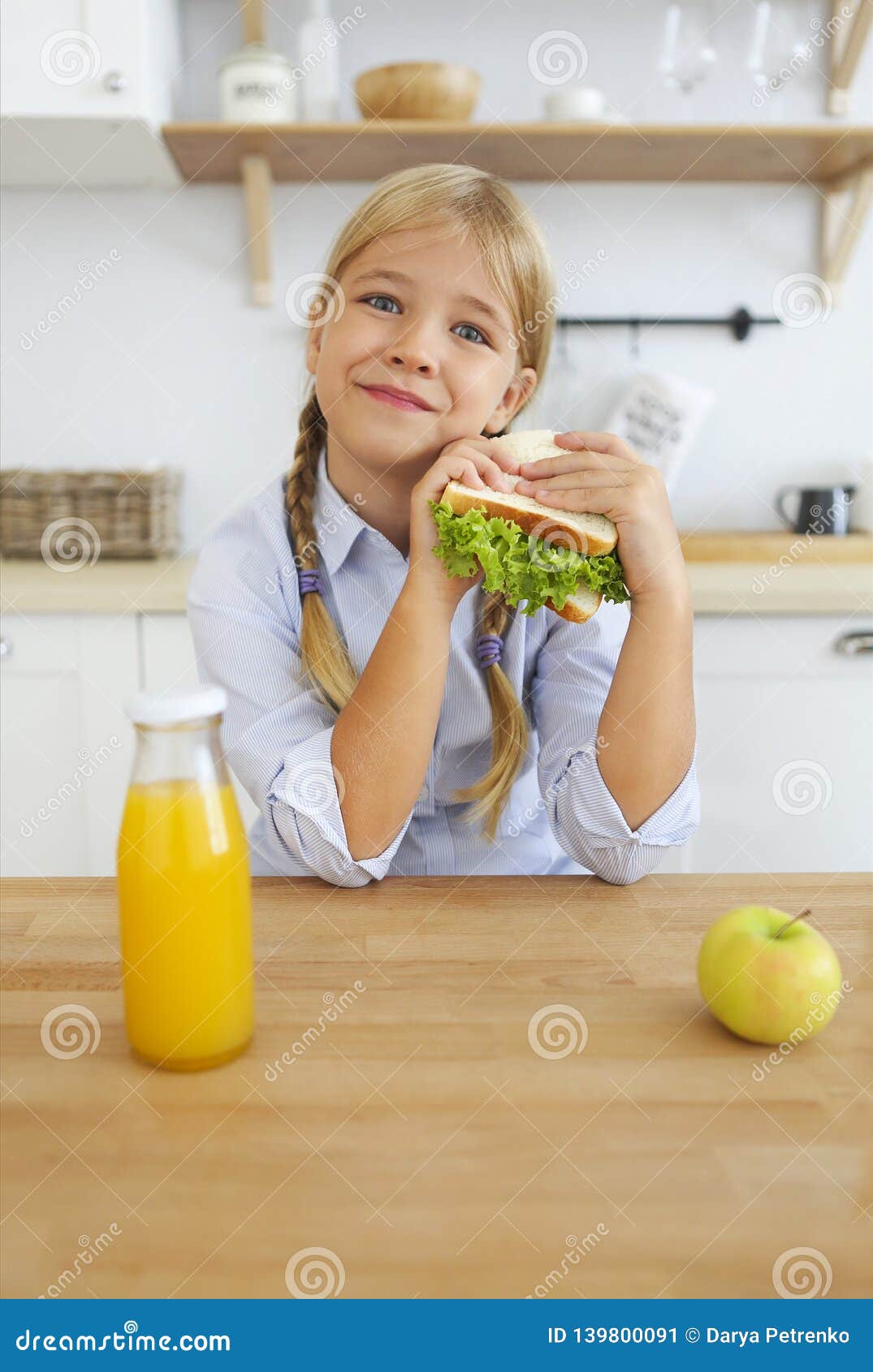 Happy Little Girl Of School Age Enjoying Healthy Breakfast ...