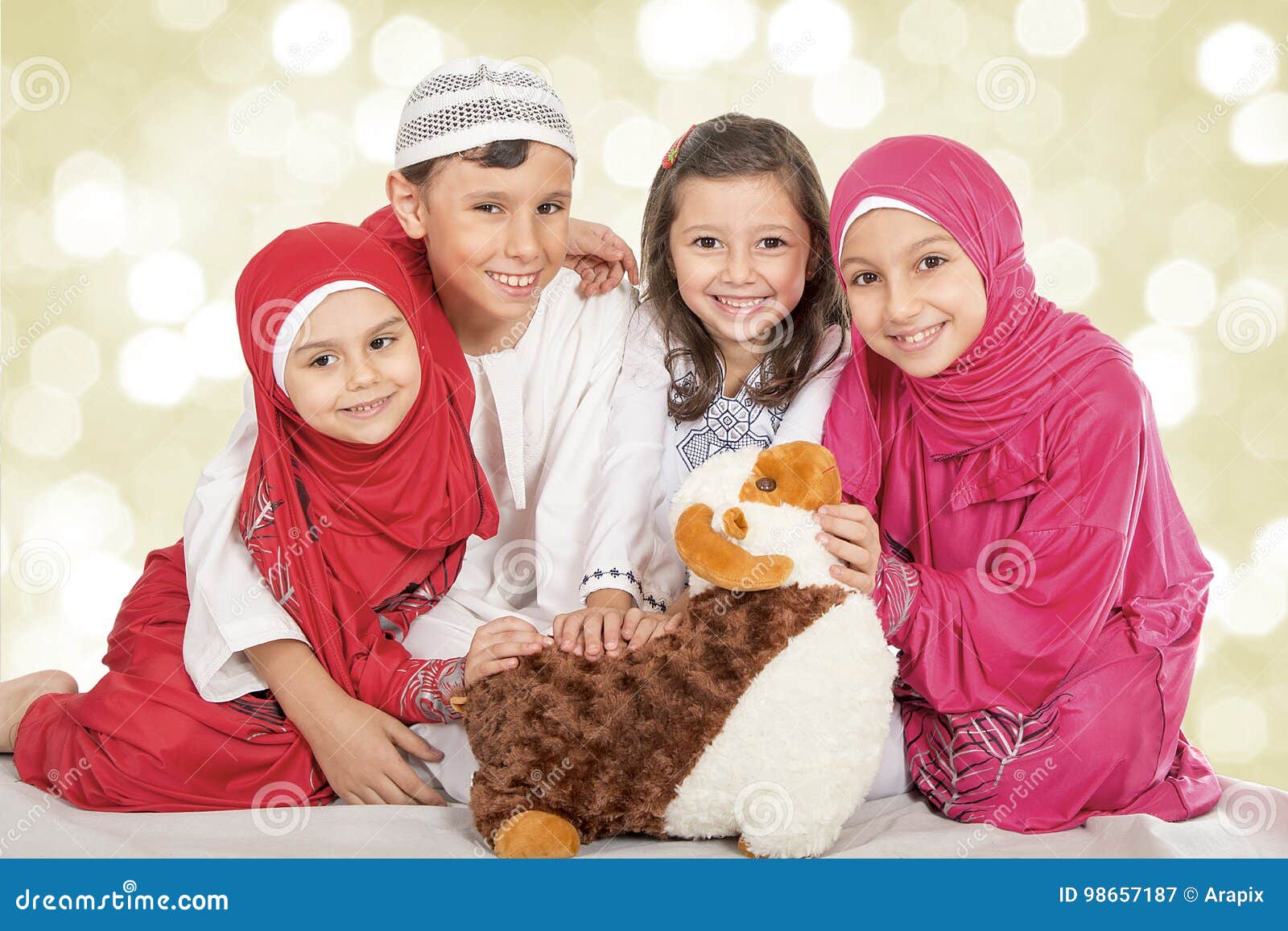 happy little muslim kids playing with sheep toy - celebrating eid ul adha - happy sacrifice feast