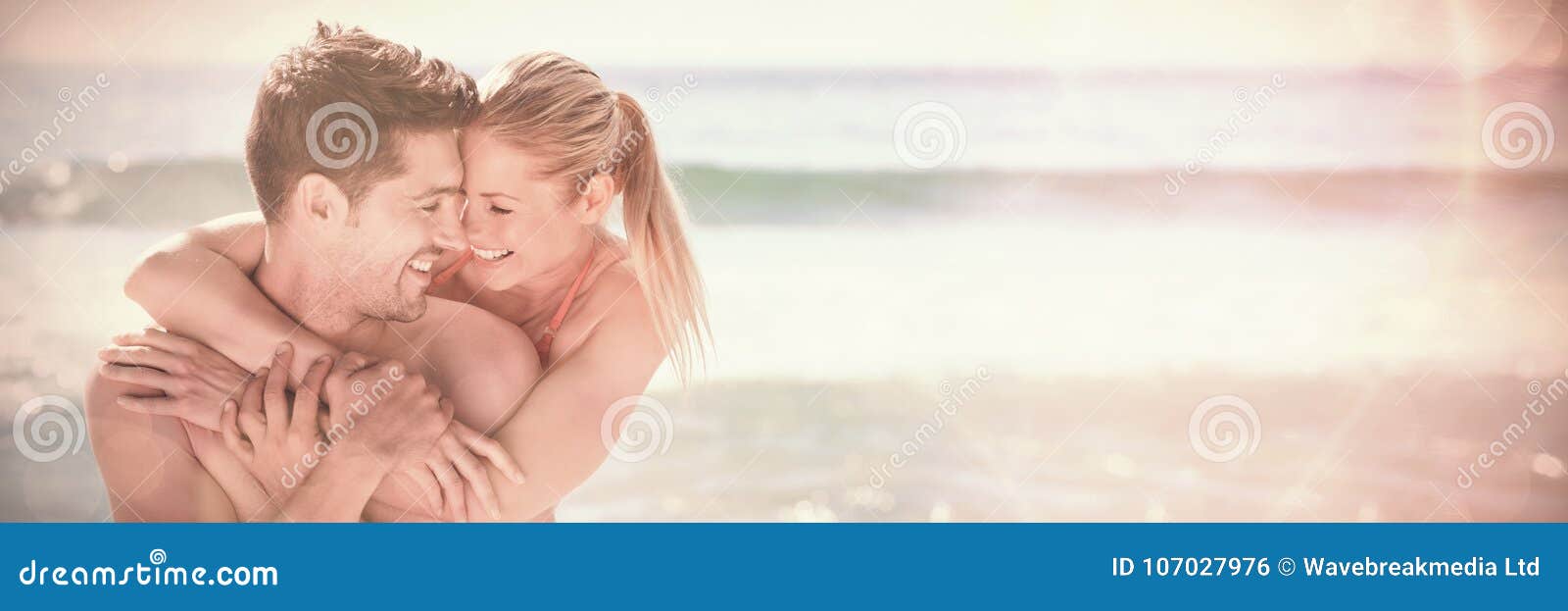 happy lovers at the beach