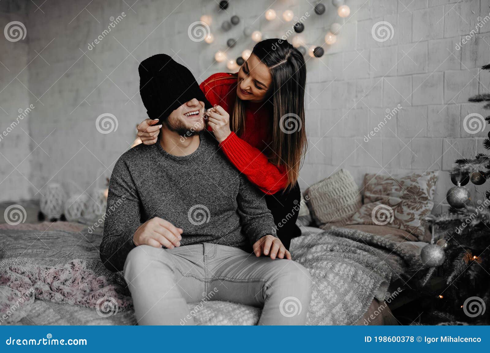 Happy Loving Couple Enjoying Christmas Having Fun Together On