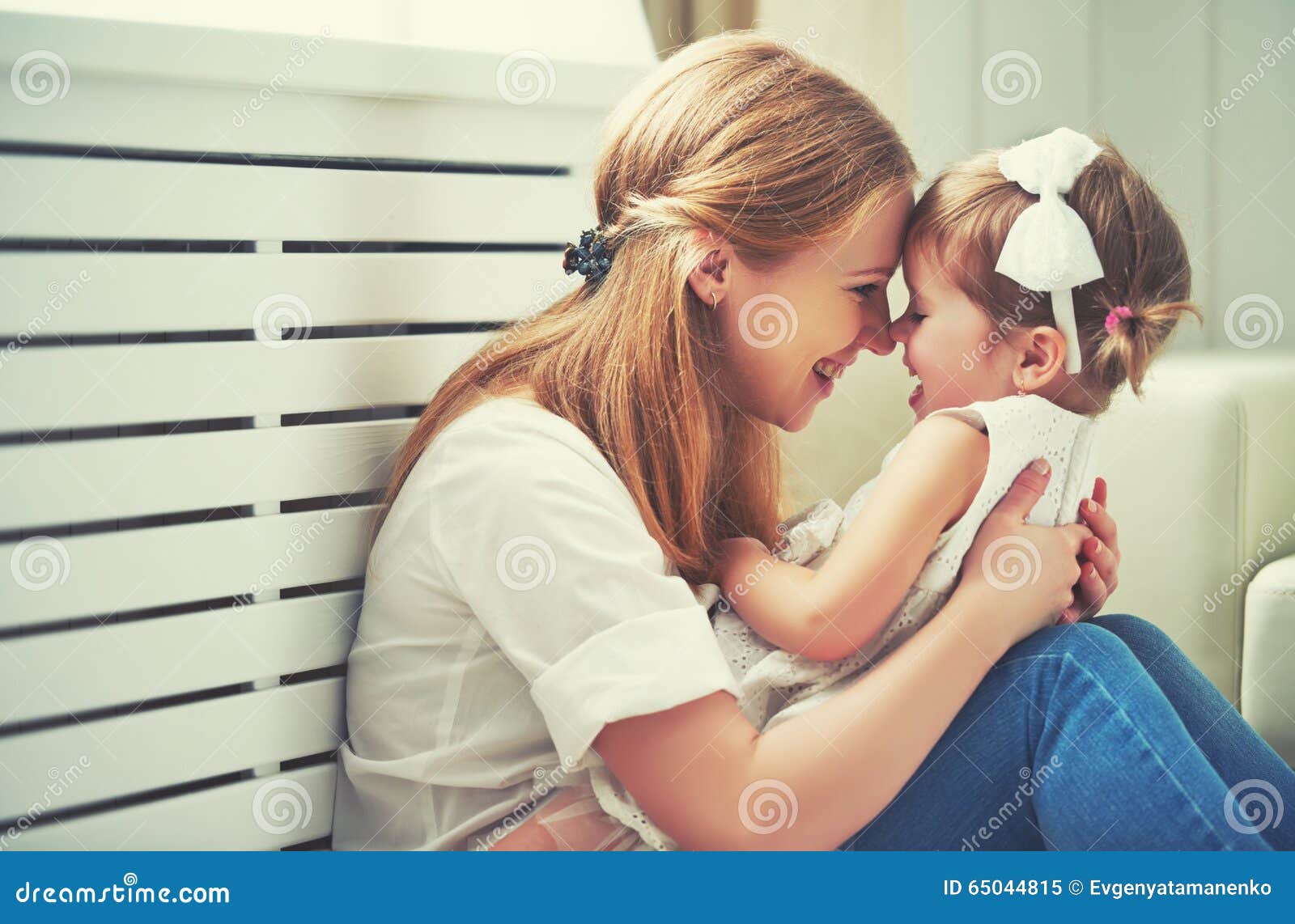 happy loving family. mother and child playing, kissing and hugg