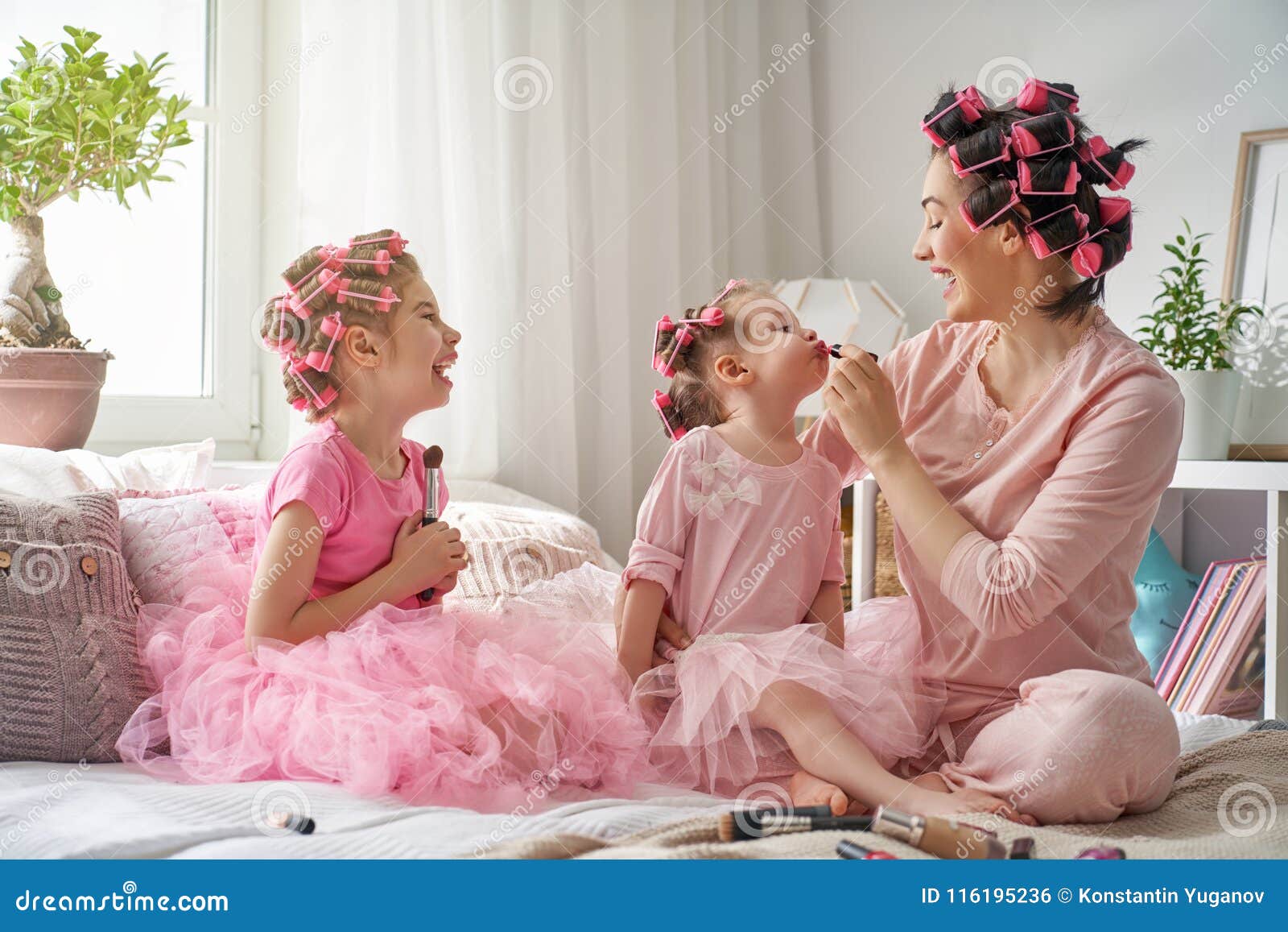 mom and children doing makeup