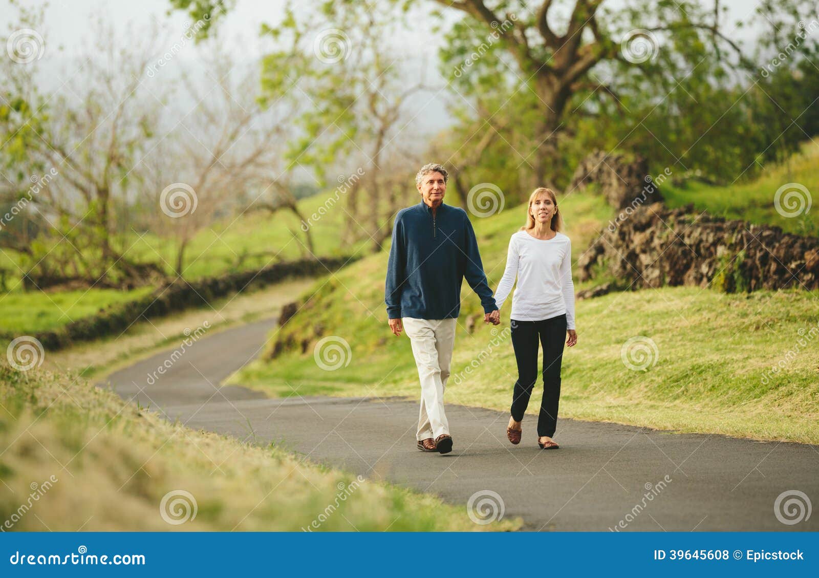 happy loving middle aged couple walking
