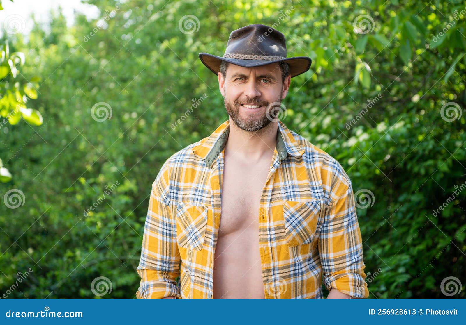 Happy Macho Man in Cowboy Hat. Macho Man in Checkered Shirt Stock Image ...