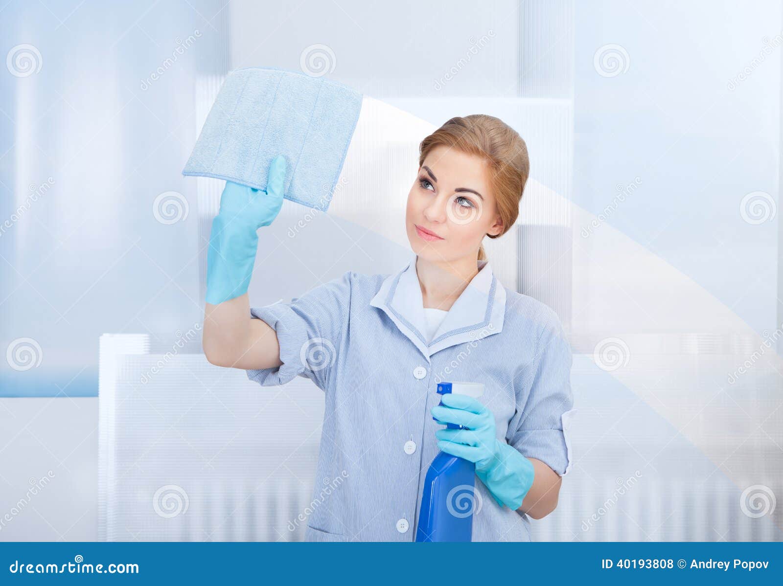 happy maid cleaning glass