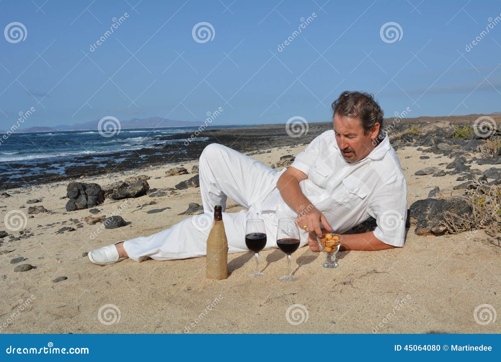 Happy Man on the Beach Has Two Glasses of Red Wine Stock Photo - Image ...