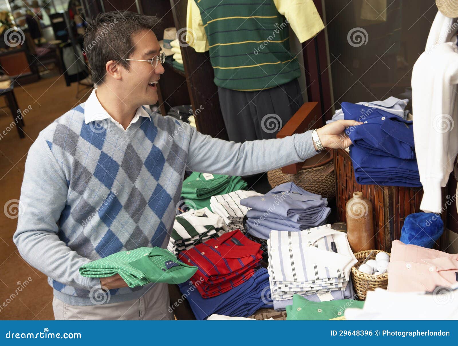 Happy Man Buying Shirts stock photo. Image of buying 29648396