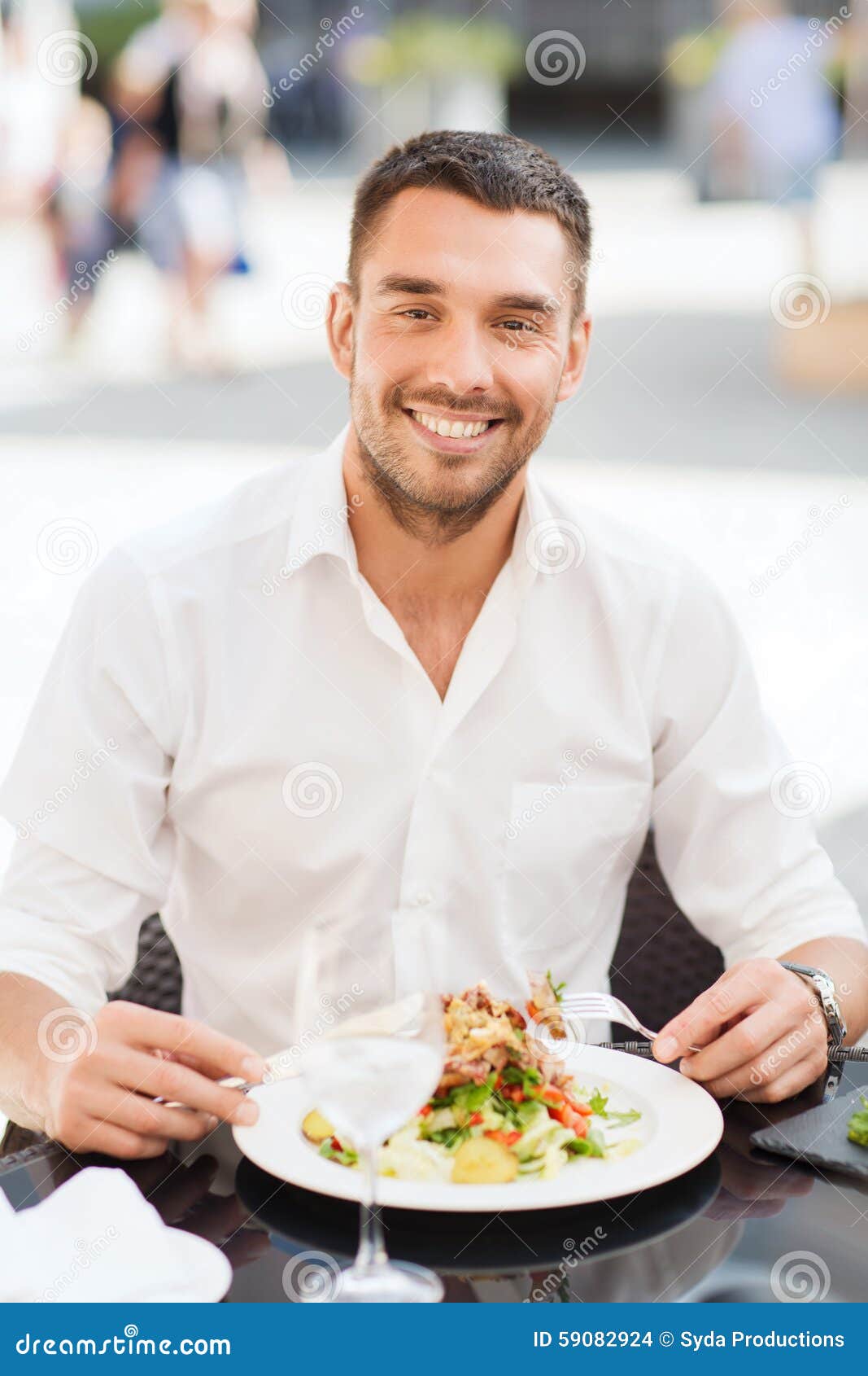 happy-man-eating-salad-dinner-restaurant-people-holidays-food-leisure-concept-fork-knife-terrace-59082924.jpg