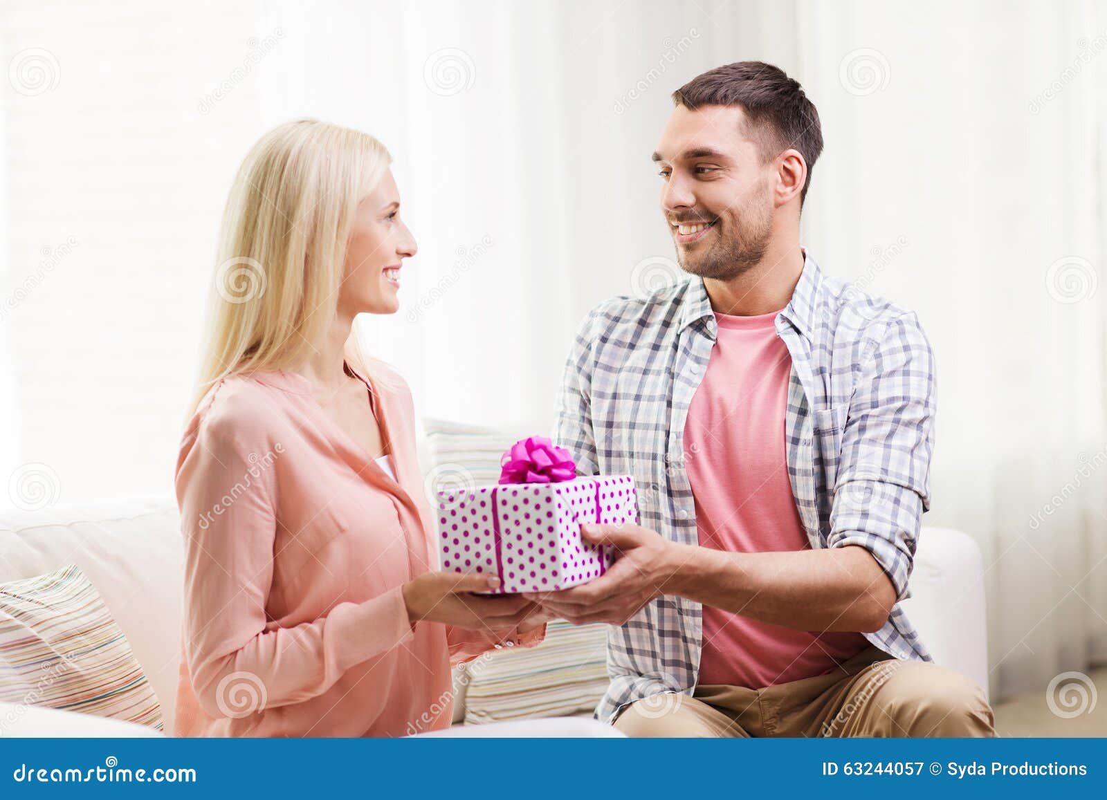 Premium Vector  Happy man holds a large gift box with a bow in his hands  vector