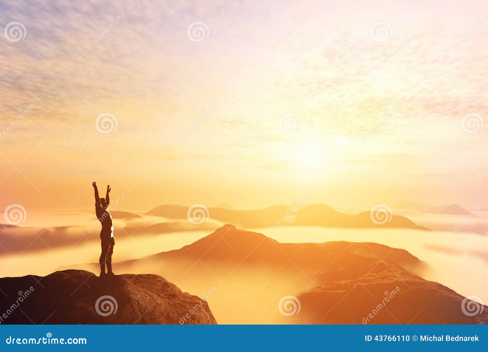 happy man with hands up on the top of the world above clouds. bright future