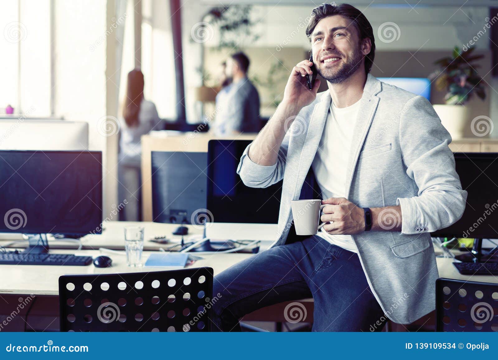 happy man having talk and drinking coffee