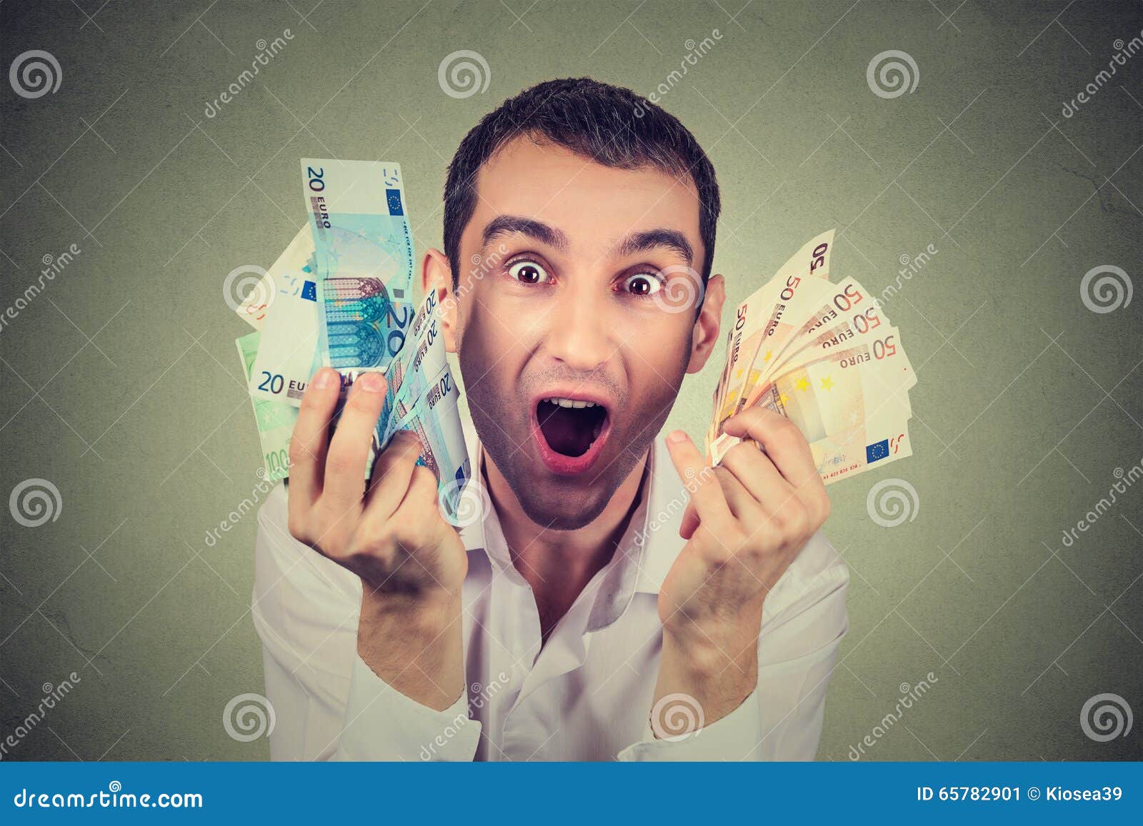 happy man with money euro banknotes ecstatic celebrates success