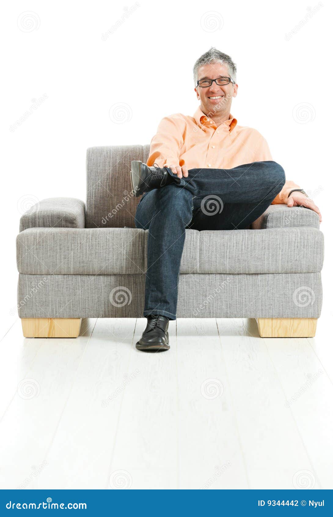 happy man sitting on couch