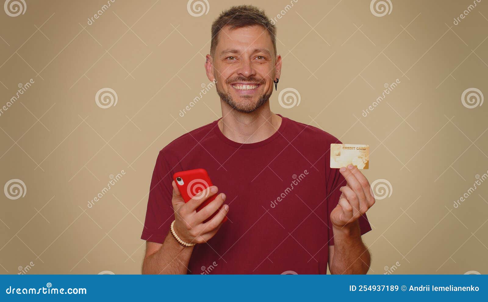 happy man use smartphone, plastic credit bank card, browsing say wow yes, found out great big win