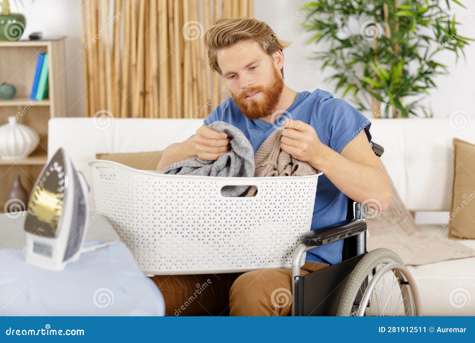 Happy Man on Wheelchair Dealing with Laundry Basket Stock Image Image