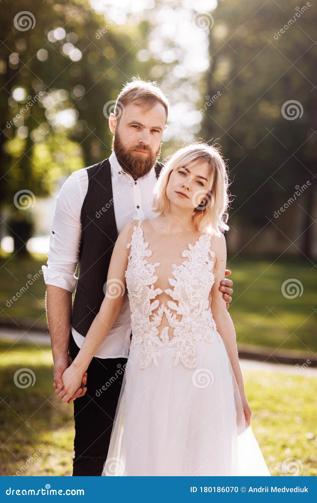 Happy Married Couple in Simple Wedding Dresses