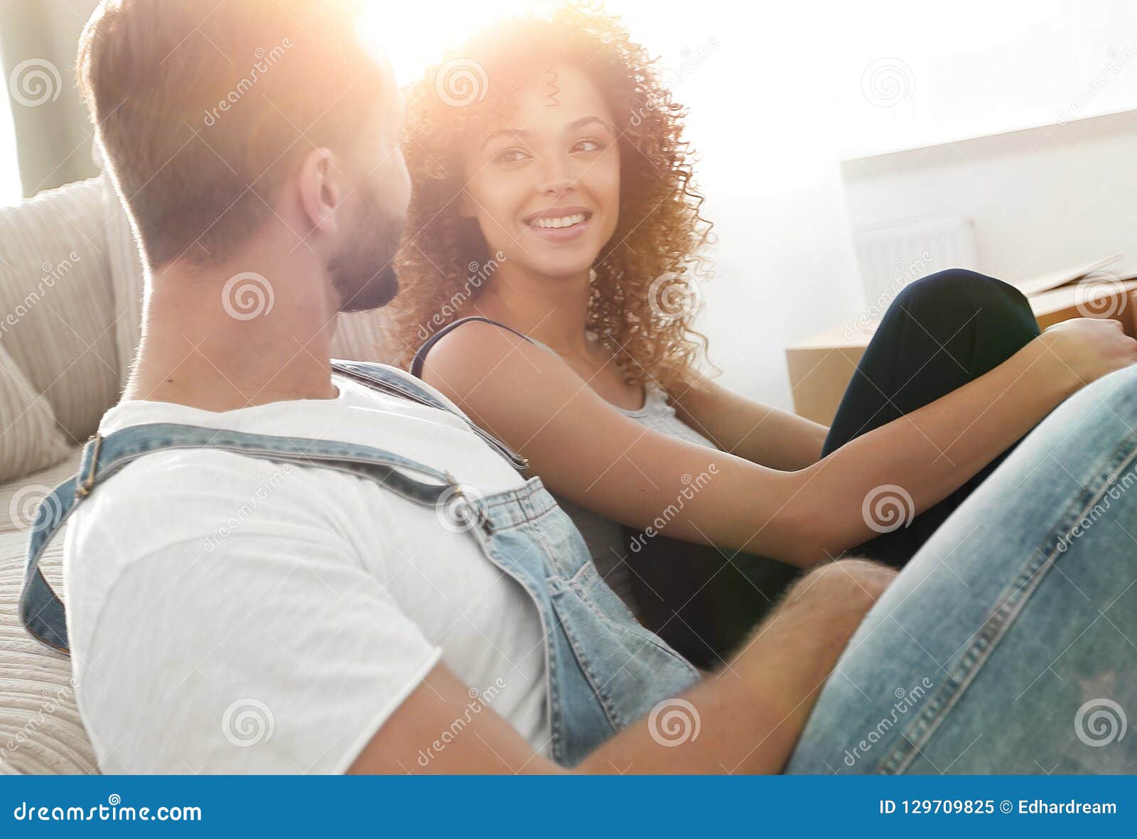 Closeup Of A Happy Married Couple Sitting In A New Apartment Stock