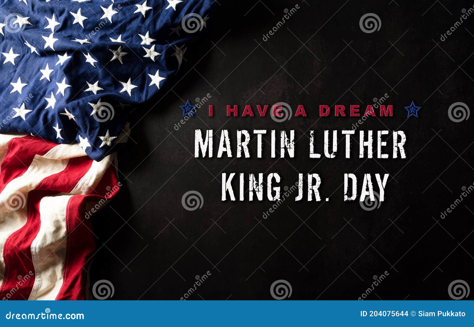 happy martin luther king day concept.  american flag againt black wooden background