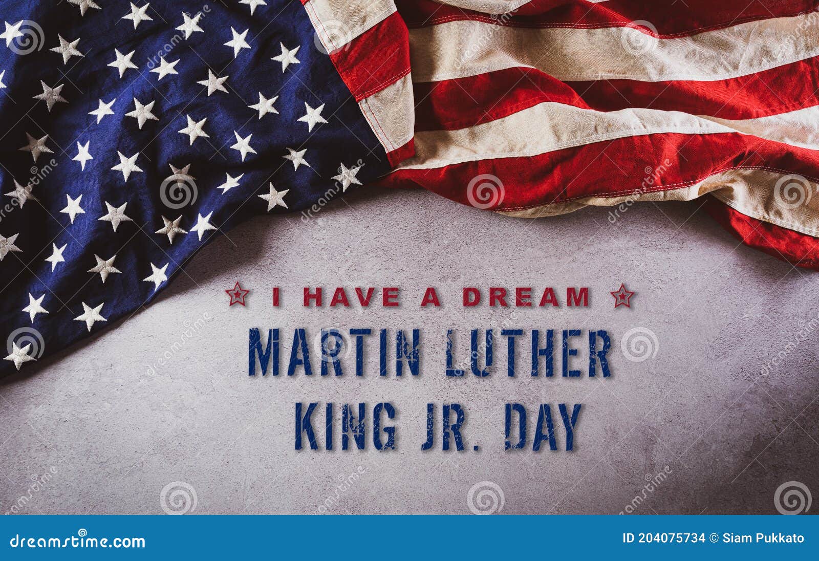 happy martin luther king day concept.  american flag againt dark stone background