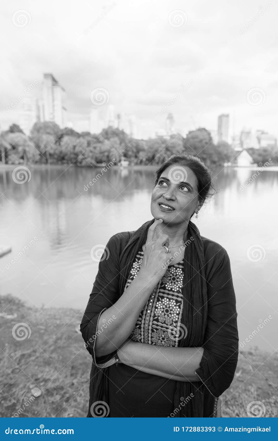 Happy Mature Beautiful Indian Woman Relaxing At The Park Stock Image