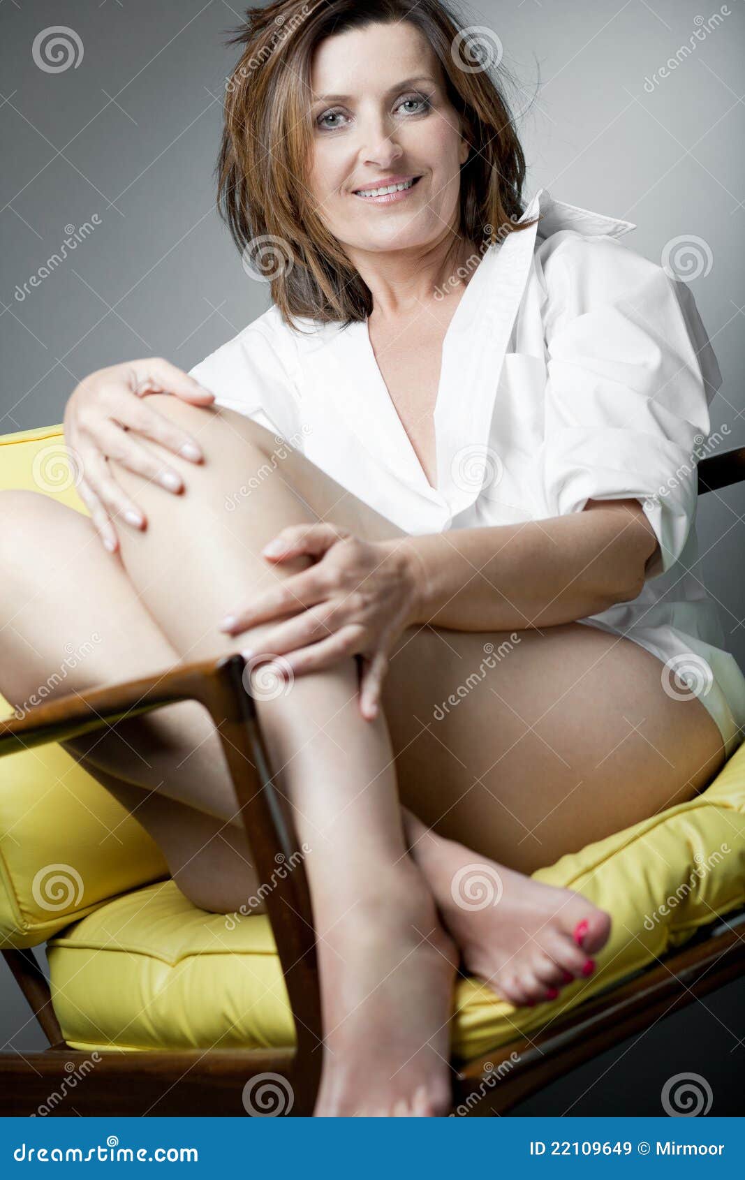 Happy Mature Woman Relaxing on Chair pic