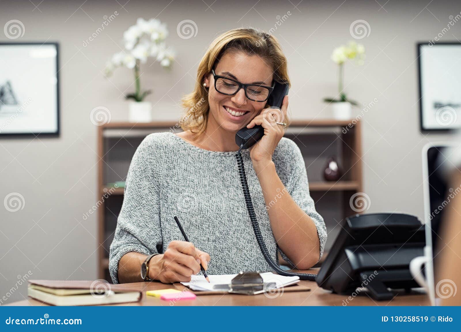 happy mature woman talking on phone