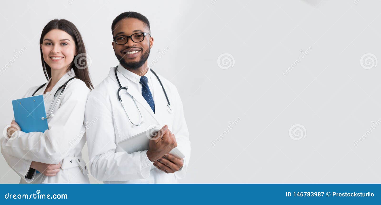 happy medic workers. portrait of two doctors in white coats