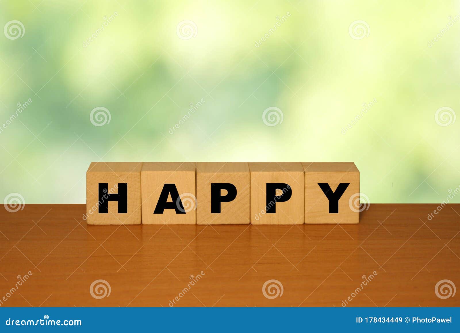 HAPPY Message Word on a Wooden Desk on Cube Blocks with a Green Nature ...