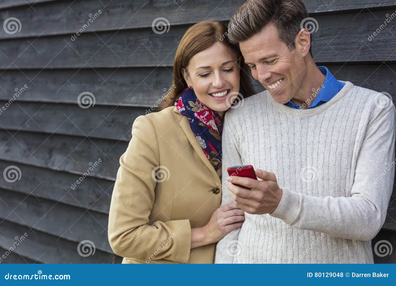 https://thumbs.dreamstime.com/z/happy-middle-aged-man-woman-couple-using-cell-mobile-phone-attractive-successful-men-women-together-outside-80129048.jpg